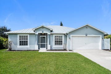 815 CHAMPION AVE LEHIGH ACRES, FL 33971